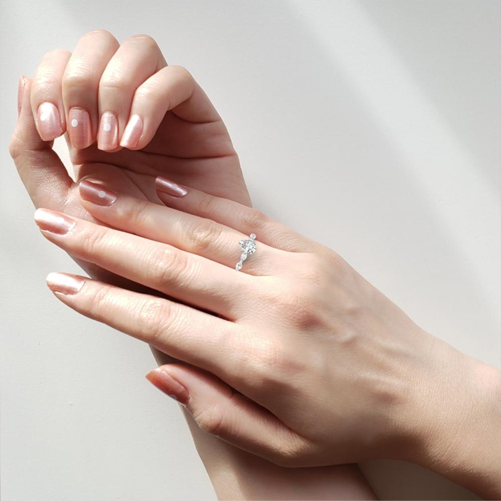 The Joanna Pear Solitaire Accent Engagement Ring