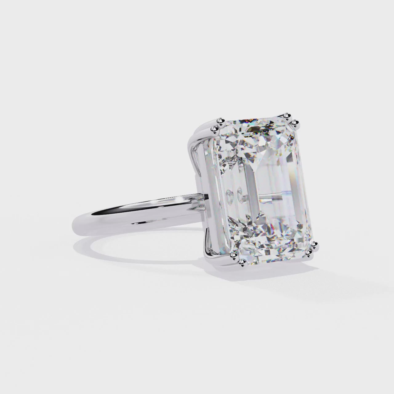 The Nori Emerald Double Claw With Basket Prong Engagement Ring