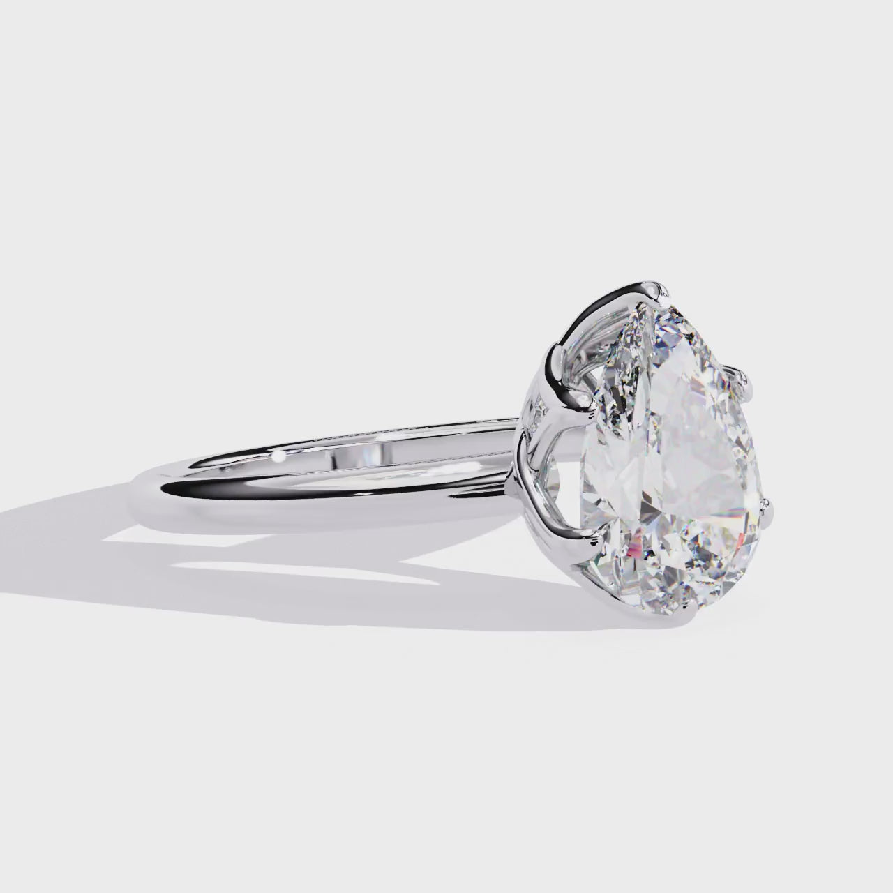 The Silvia Pear Solitaire Lotus Prong Engagement Ring