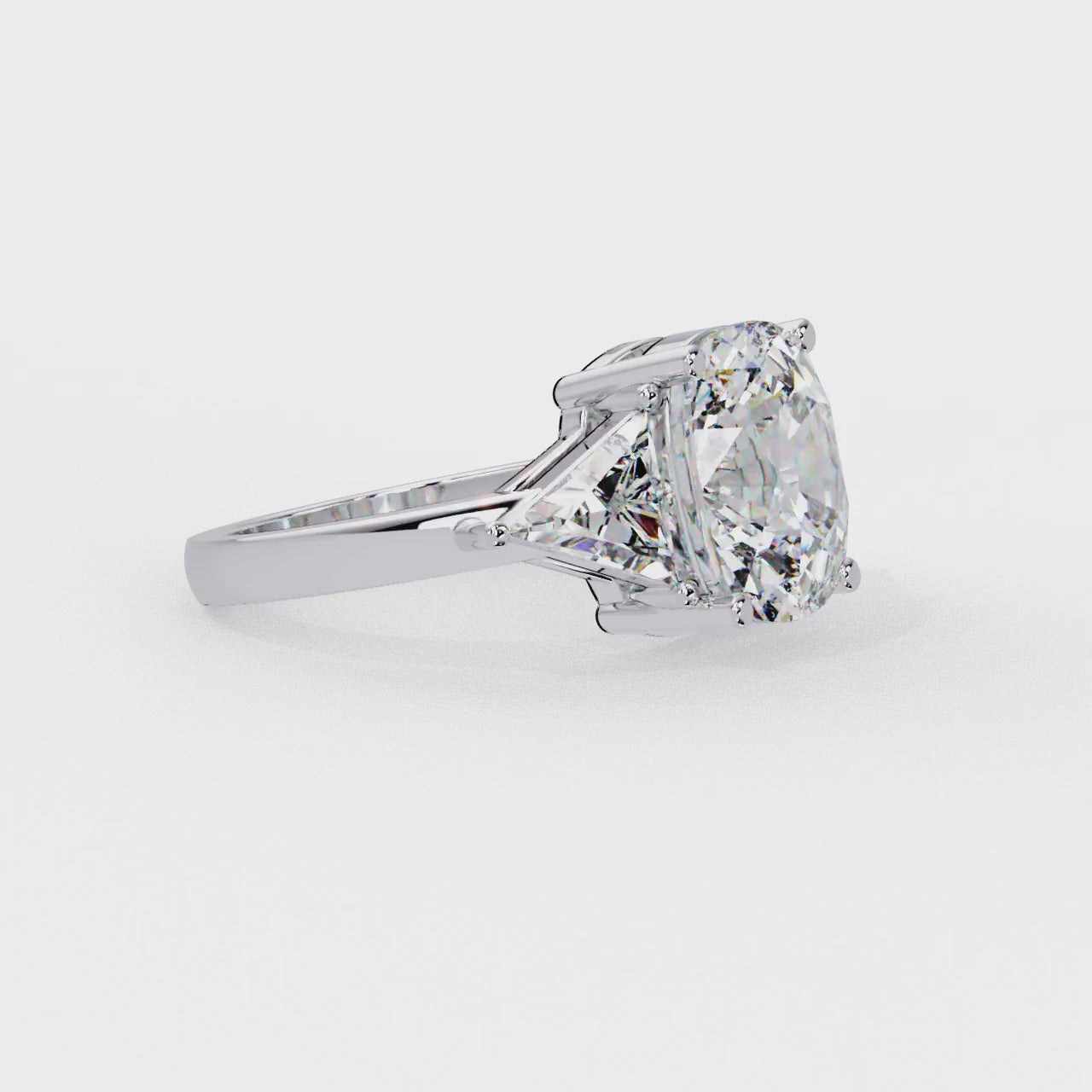 The Stella Elongated Cushion With Triangle Three Stone Engagement Ring