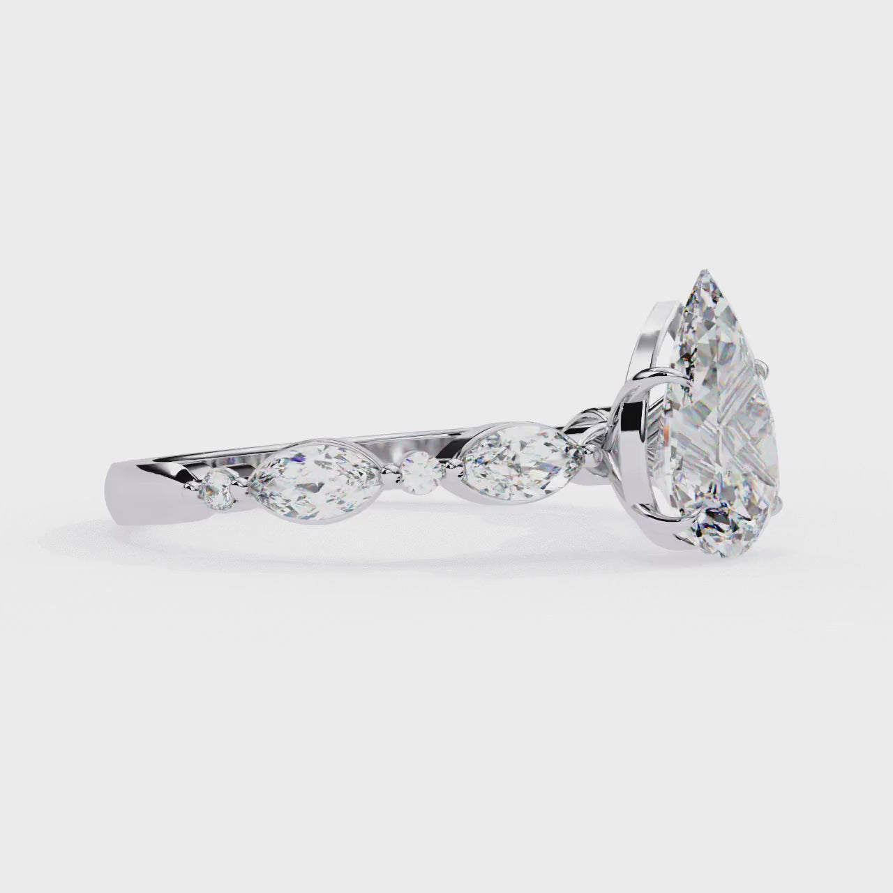 The Joanna Pear Solitaire Accent Engagement Ring