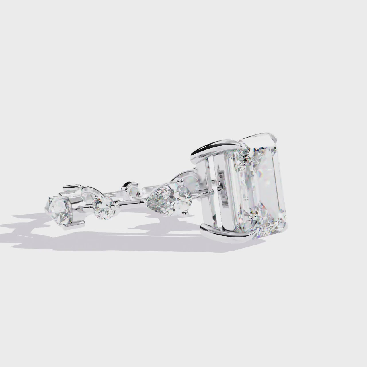 The Amelia Emerald Solitaire With Space Stone Engagement Ring