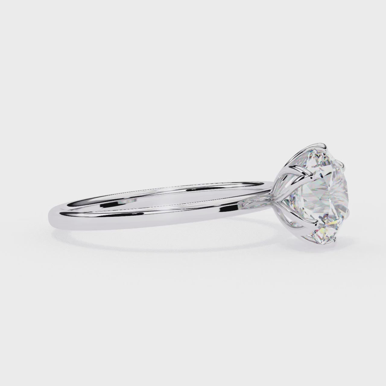 The Laura Round Solitaire with Flower Prong Engagement ring