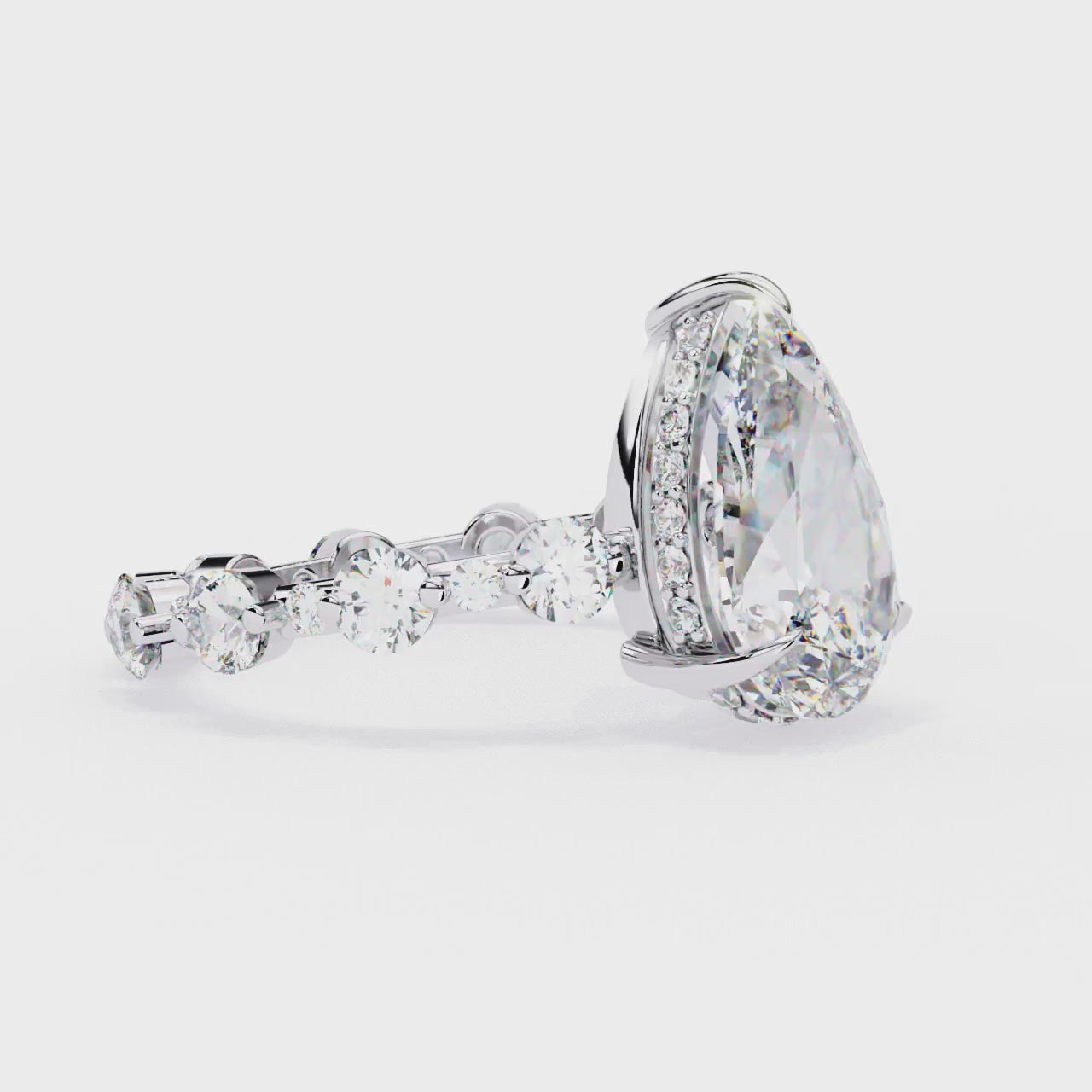 The Desiree Pear Hidden Halo with Shared Prong Engagement Ring