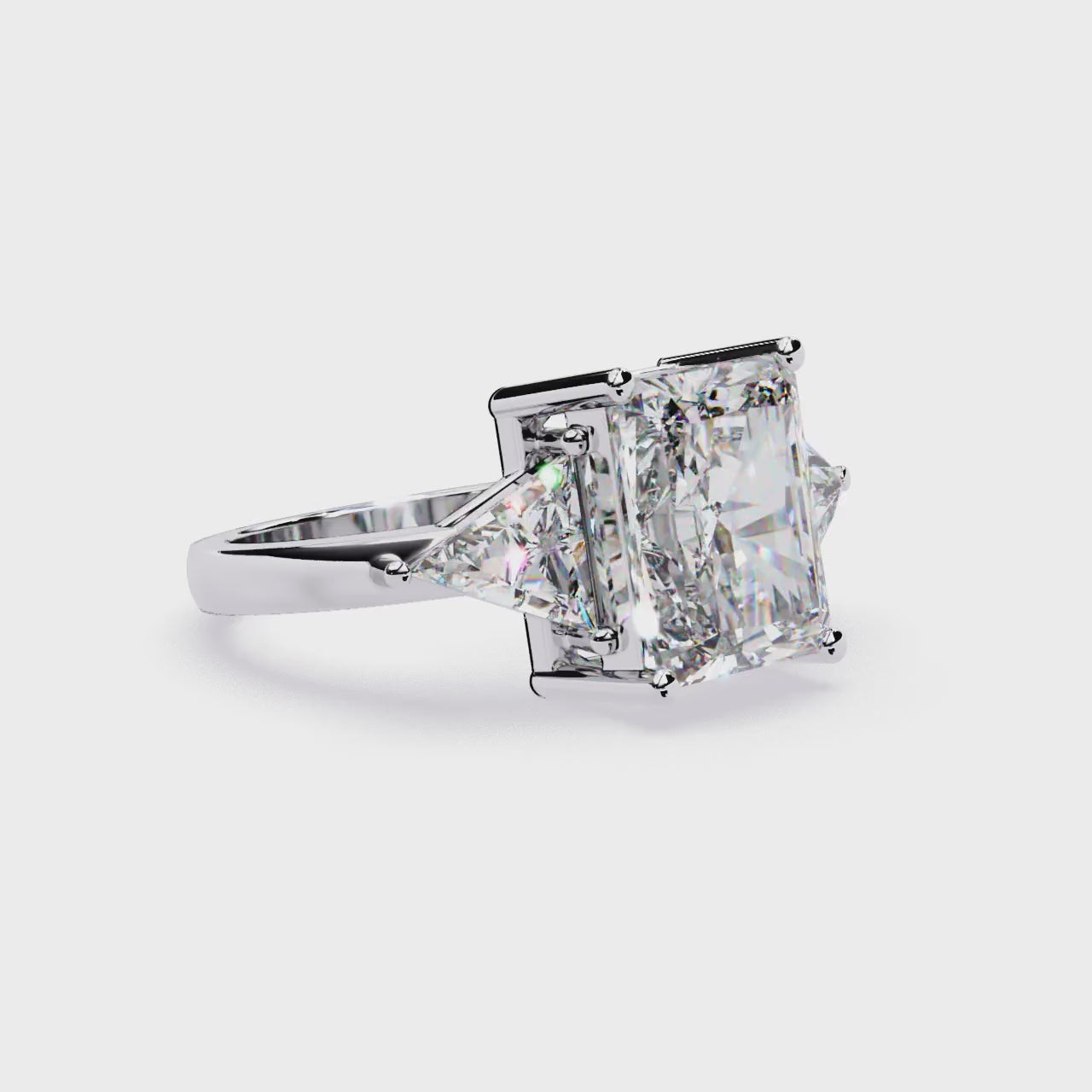 The Stella Radiant With Triangle Three Stone Engagement Ring