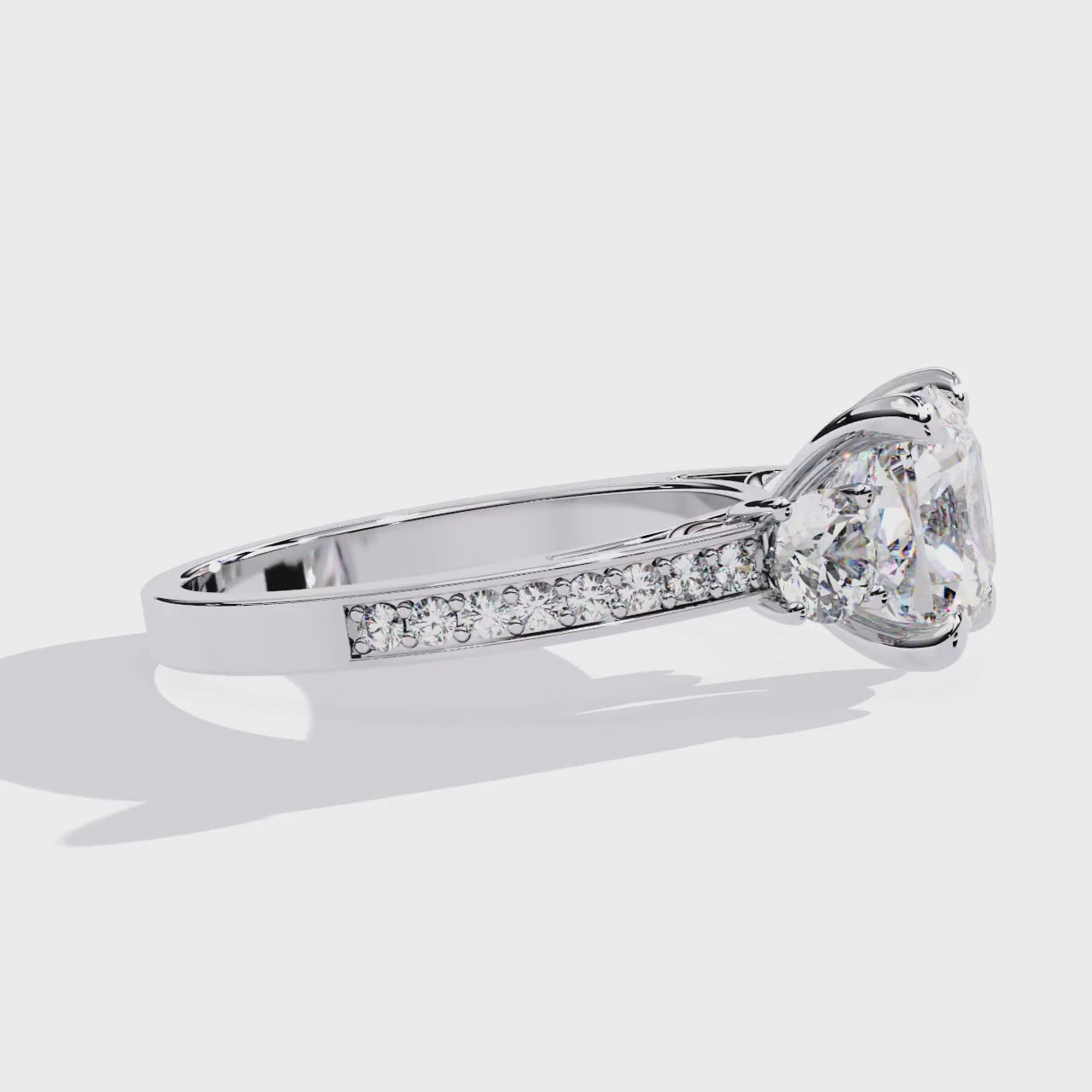 The Stray Cushion Three Stone with Studded Shank Engagement Ring