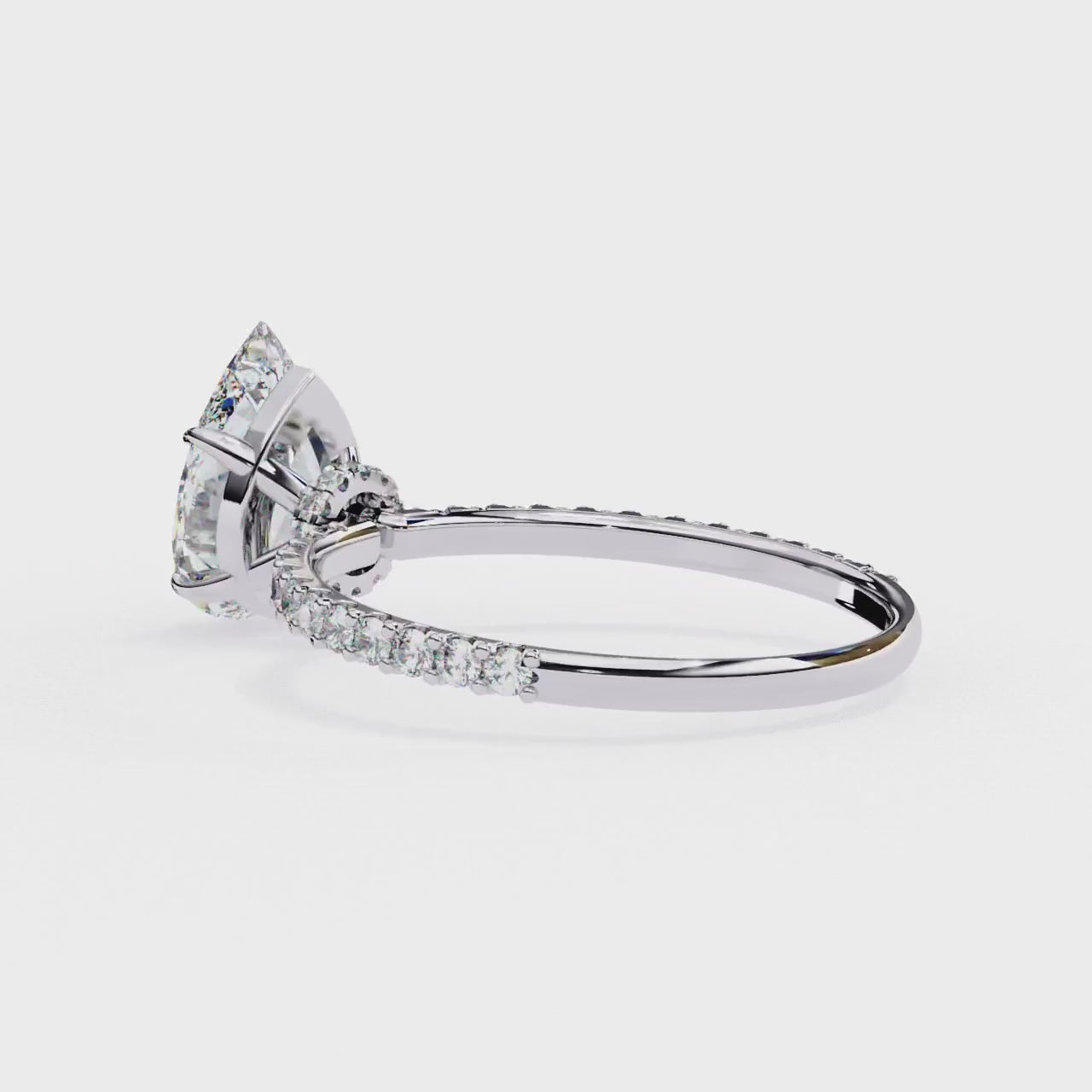 The Erica Pear Mystic Secret Halo Engagement ring
