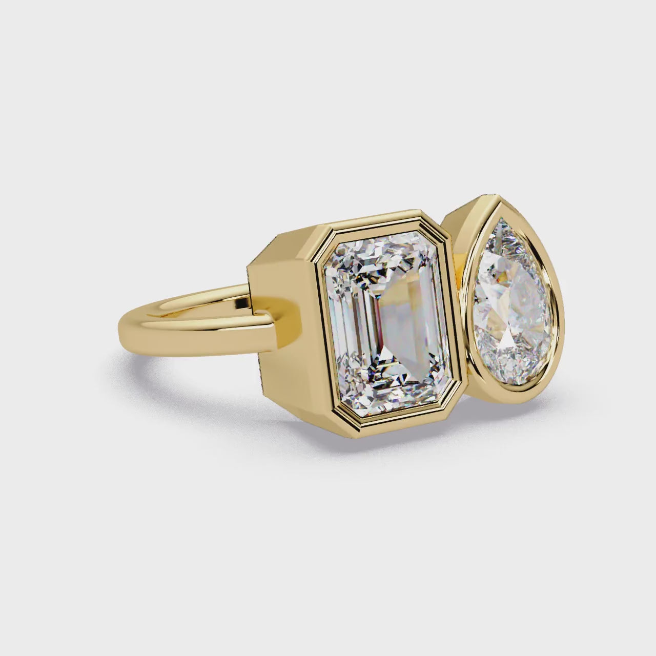 The Sofia Pear & Emerald Bezel Toi Et Moi Engagement ring